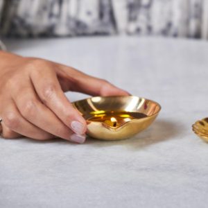 Una brass diya